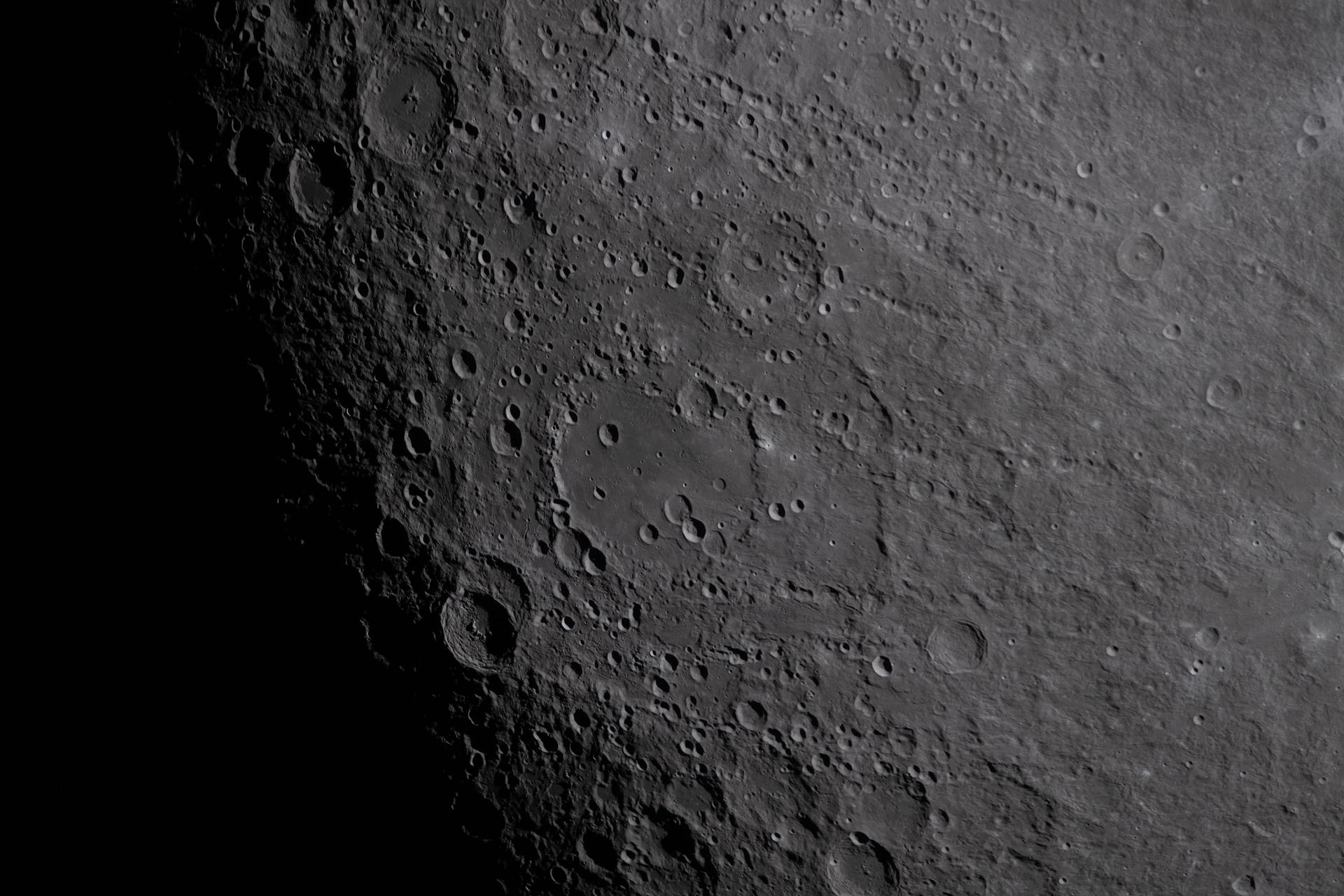 Detailed close-up of the Moon's cratered surface
